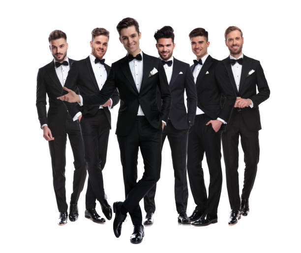istock happy elegant man in tuxedo presenting his team 1147265788
