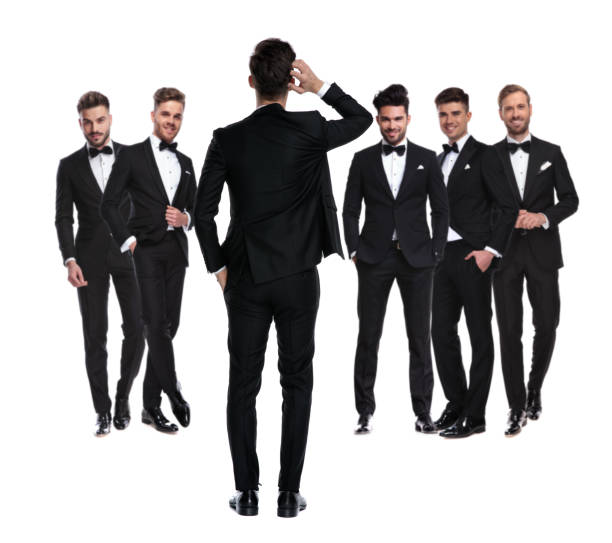 istock confused groom scratching  head while standing in front of  team 1147266395