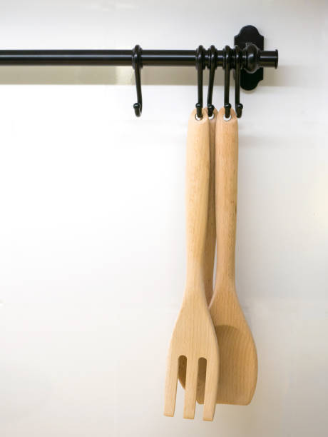 istock Wooden Utensils Hanging Against Wall 1147268142