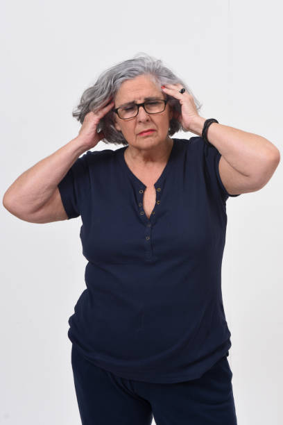 istock woman with headache on white background 1147268658