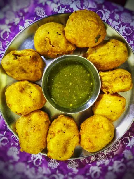 Photo of Popular Indian Snack 'Aloo Besan Chop' and 'Dhaniya/Coriander Patta Spicy Chutney' top view.