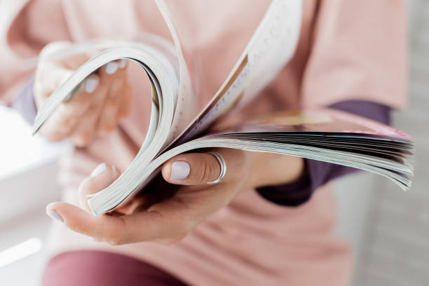 istock Young woman with a booklet with blank pages 1147271863