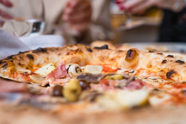 istock Italian pizza on the dinner table 1147272823