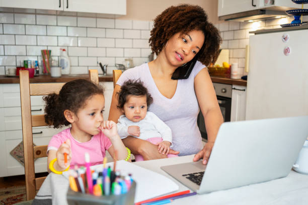 istock Mother and daughter's using laptop at home 1147273754