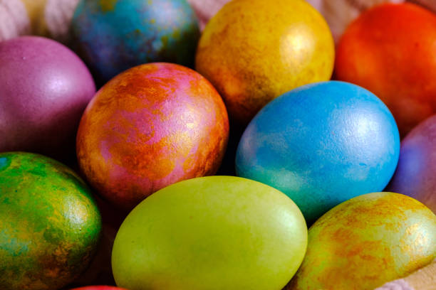 istock Easter cakes and colored eggs on a wooden table 1147274181