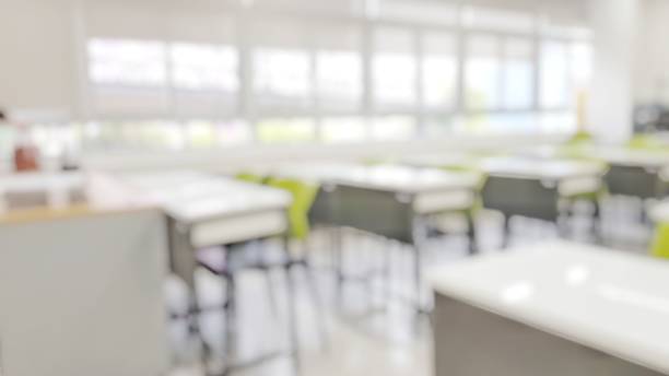 istock School classroom in blur background without young student; Blurry view of elementary class room no kid or teacher with chairs and tables in campus. 1147275330