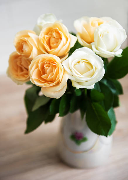 istock Yellow and white roses 1147275401