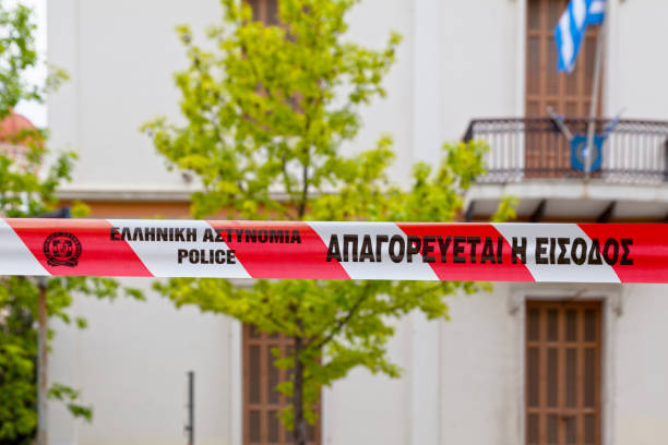 Thessaloniki, Greece - May 04 2019: White and red police tape of the Hellenic Police saying in Greek \