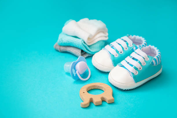 istock baby accessories for newborns on a colored background. selective focus. 1147275583