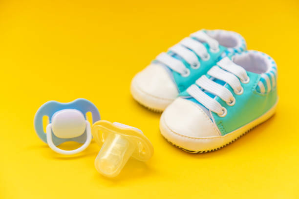 istock baby accessories for newborns on a colored background. selective focus. 1147275623