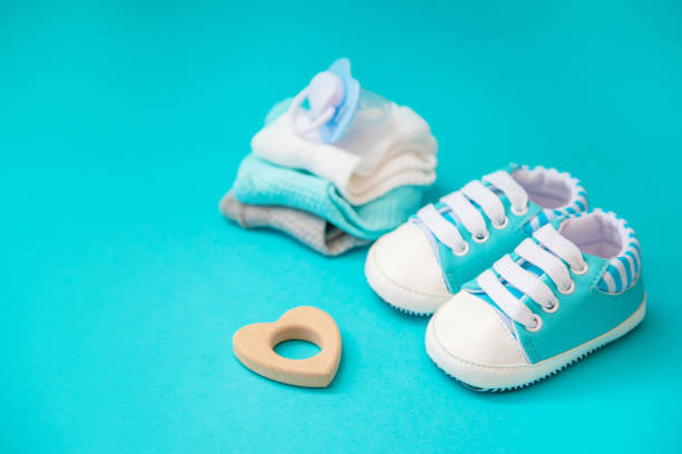 istock baby accessories for newborns on a colored background. selective focus. 1147275629