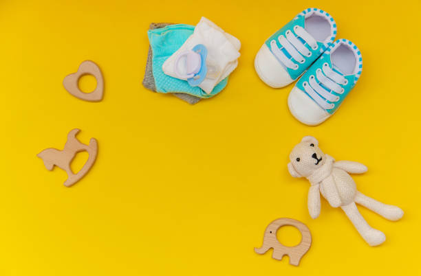 istock baby accessories for newborns on a colored background. selective focus. 1147275642
