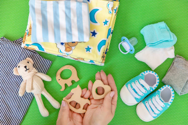 istock baby accessories for newborns on a colored background. selective focus. 1147275716