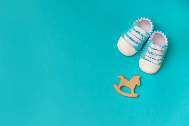 istock baby accessories for newborns on a colored background. selective focus. 1147275802