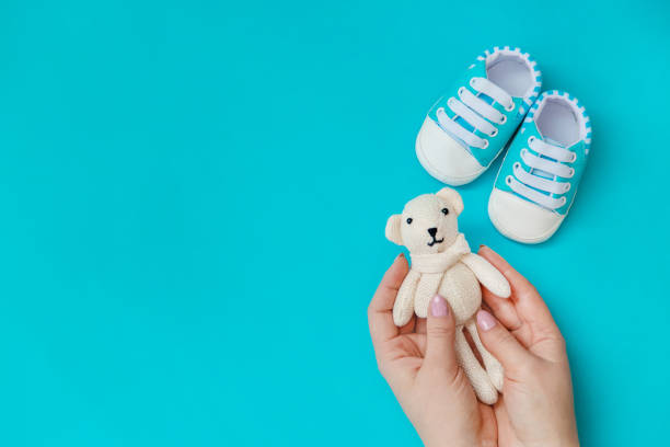 istock baby accessories for newborns on a colored background. selective focus. 1147275874