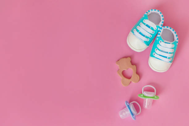 istock baby accessories for newborns on a colored background. selective focus. 1147275878
