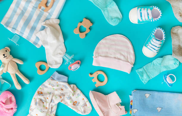 baby accessories for newborns on a colored background. selective focus. baby accessories for newborns on a colored background. selective focus. nature. baby goods stock pictures, royalty-free photos & images