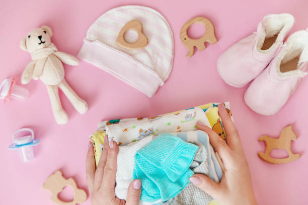 istock baby accessories for newborns on a colored background. selective focus. 1147275940