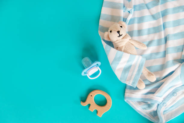istock baby accessories for newborns on a colored background. selective focus. 1147275978
