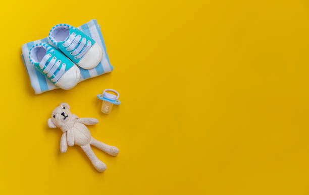 istock baby accessories for newborns on a colored background. selective focus. 1147275979