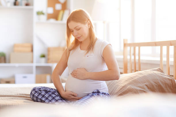istock Pregnant Woman in Sunlight 1147277632