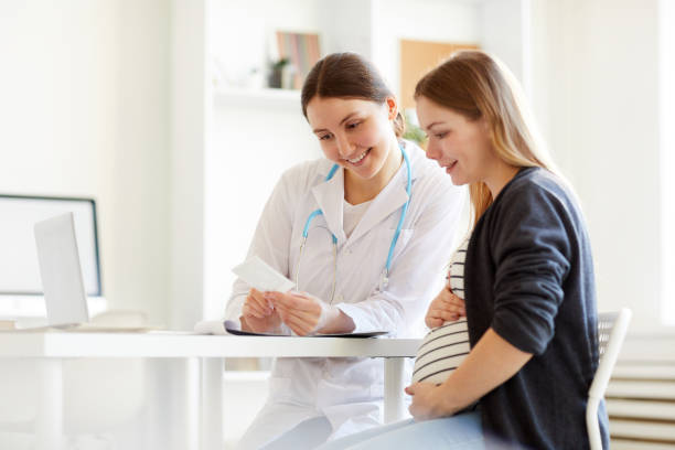 istock Pregnant Woman at Checkup 1147277725