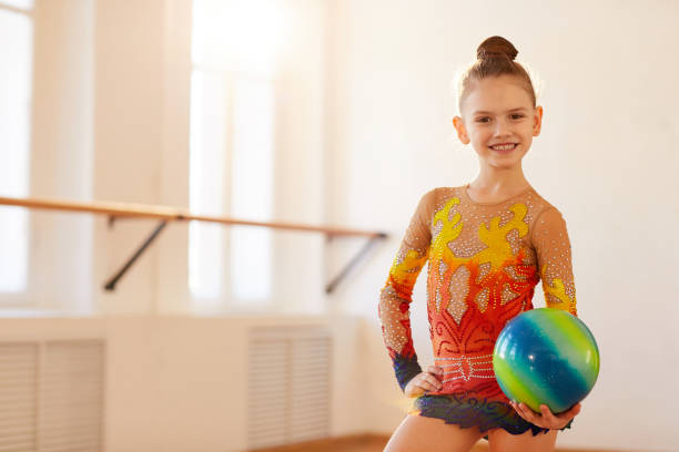 istock Girl Gymnast Posing 1147278971
