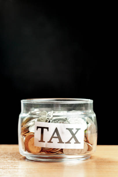 istock glass jar used for saving US dollar bills and notes for IRA retirement fund 1147279121