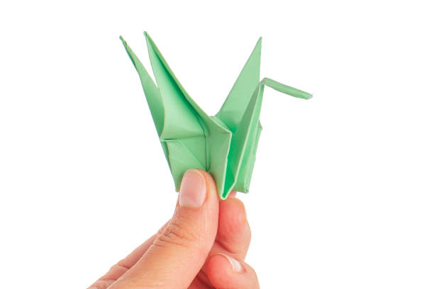 istock origami crane on white background 1147281375