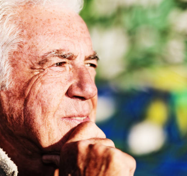 istock Profile of senior man squinting into sun 1147281994