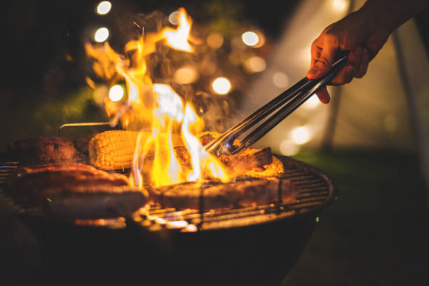 barbecue camping Family making barbecue in dinner party camping at night dome tent photos stock pictures, royalty-free photos & images