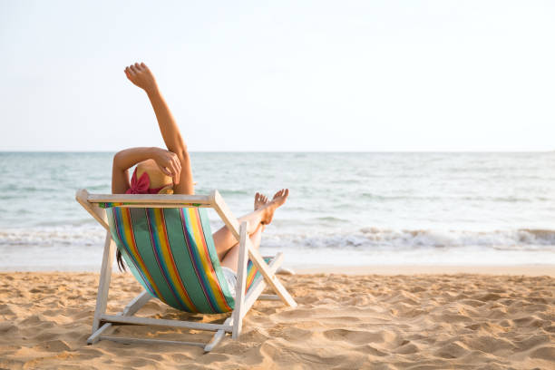 istock Woman on beach in summer 1147284415