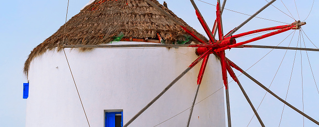 Greek iconic windmill close-up banner background in Mykonos, Greece, famous island in Cyclades