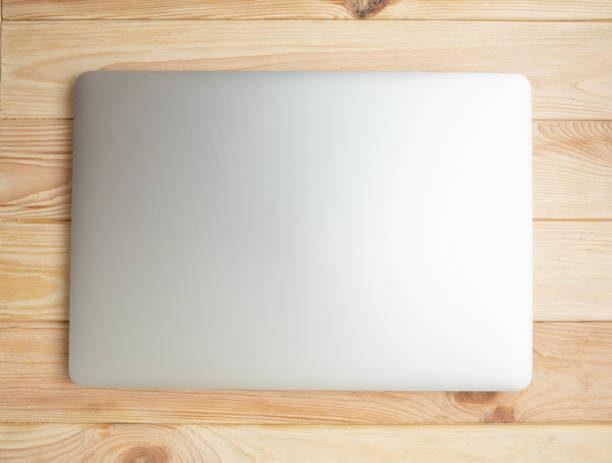 istock laptop on a wooden background 1147284734