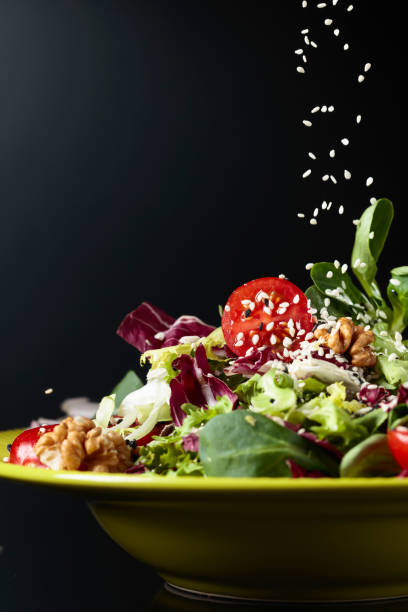 istock Salad with cherry tomatoes,  sesame, walnuts and vegetable oil. 1147284885