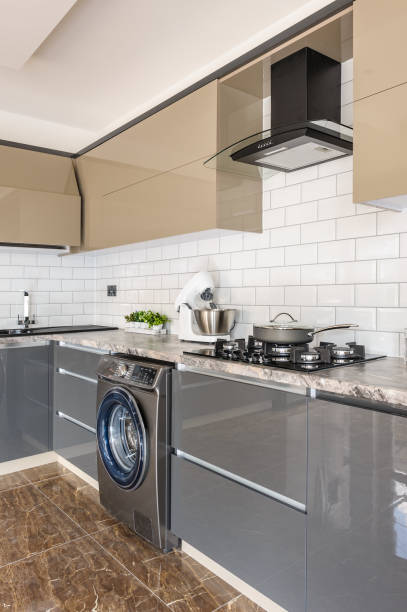istock Closeup of luxury modern white, beige and grey kitchen interior 1147286098