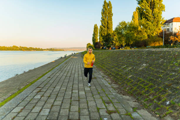 istock Athlete Jogging Near the River 1147286394