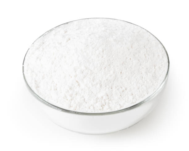 istock Wheat flour in glass bowl isolated on white background with clipping path 1147288207
