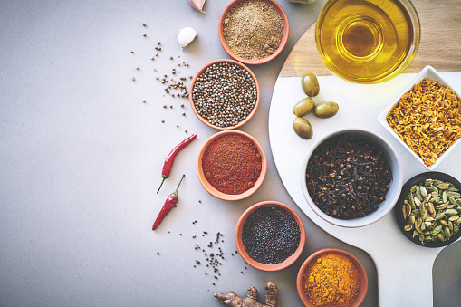 Various spices in a bowls on white background close up