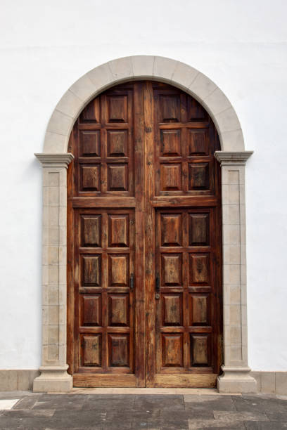 Brown door in white wall