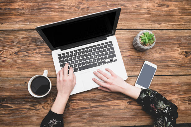 istock Woman using laptop and smartphone 1147296850