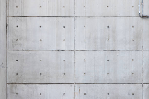 bare concrete wall with symmetry line, free copy space for text. pre cast concrete panel. - cast in stone imagens e fotografias de stock