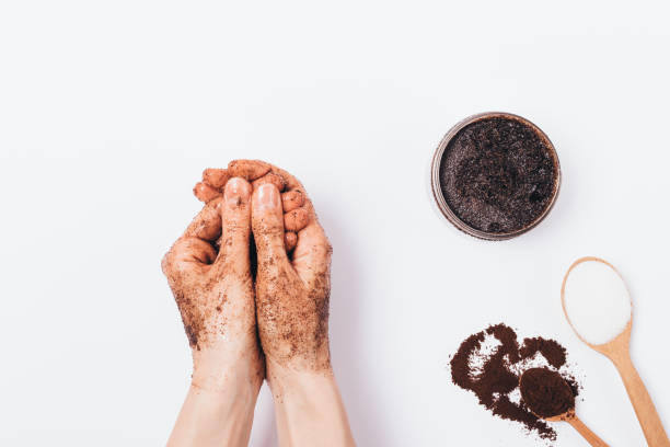 istock Woman's hands apply cosmetic scrub of ground coffee 1147301231