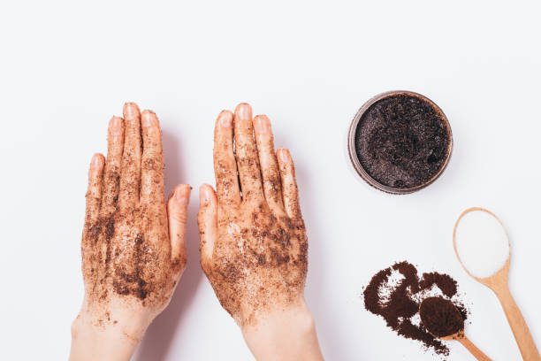 istock Young woman's hands apply cosmetic scrub 1147301241