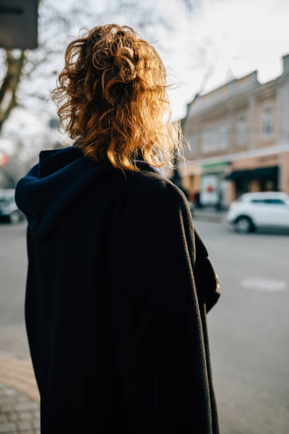istock View from back young woman with curly hair 1147301358