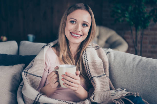 Close-up portrait of lovely pondering planning cute sweet nice she her lady enjoying fun joy smelling aromatic latte sitting on divan Close-up portrait of lovely pondering planning cute sweet nice she her lady enjoying fun joy smelling aromatic latte sitting on divan. plaid couch stock pictures, royalty-free photos & images