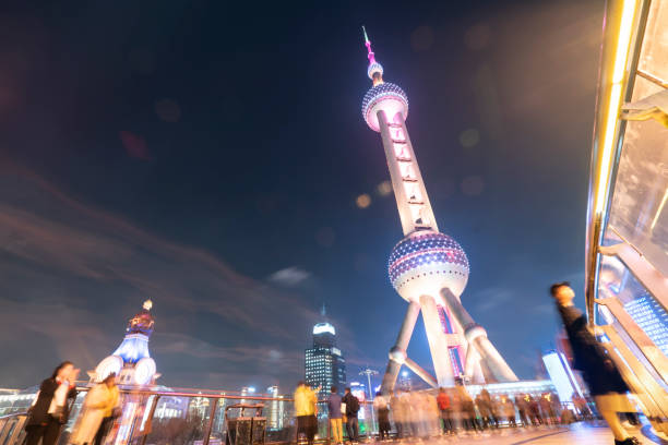 Night cityscape of Shanghai captured from a building terrace.