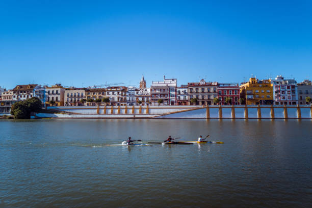 Seville, Spain, October 29, 2018: Kayakers on the the Guadalquivir river, in front of the Triana area in Seville, Spain