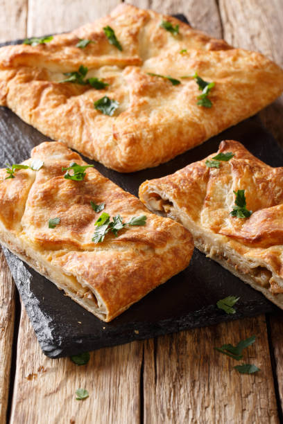 istock Georgian bread Khachapuri with Suluguni cheese, eggs close-up. vertical 1147308959