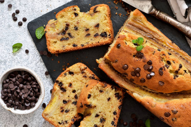 istock Banana cake with chocolate drops on the kitchen table. Classic dessert. 1147309790
